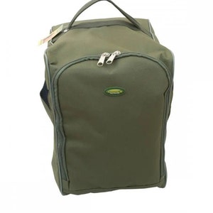 May include: A green canvas duffel bag with a zipper closure and a black handle. The bag has a small green and yellow logo that says "Adventure" on it.