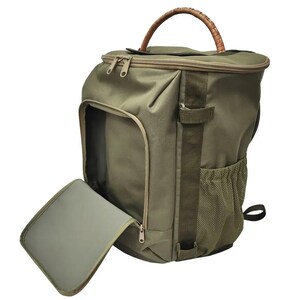 May include: A green canvas backpack with a brown leather handle and a zippered front pocket. The backpack has a mesh side pocket and a padded laptop compartment.
