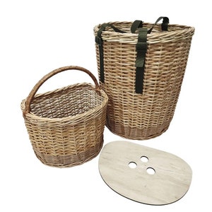 May include: Two woven wicker baskets with a wooden lid. The larger basket has two green straps and the smaller basket has a handle.