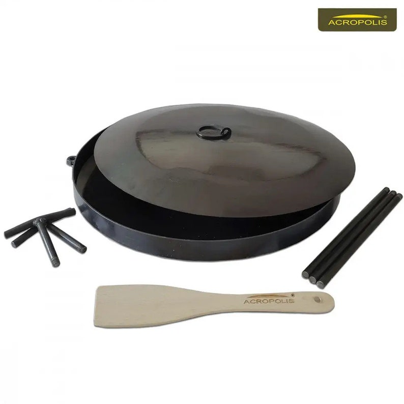May include: A black metal fire pit with a lid, a wooden spatula, and three metal legs. The fire pit is 61 cm in diameter and has a 30 cm high lid. The spatula is 30 cm long and has a wooden handle. The legs are 30 cm long and are made of metal. The fire pit is made of heavy-duty steel and is designed for outdoor use.