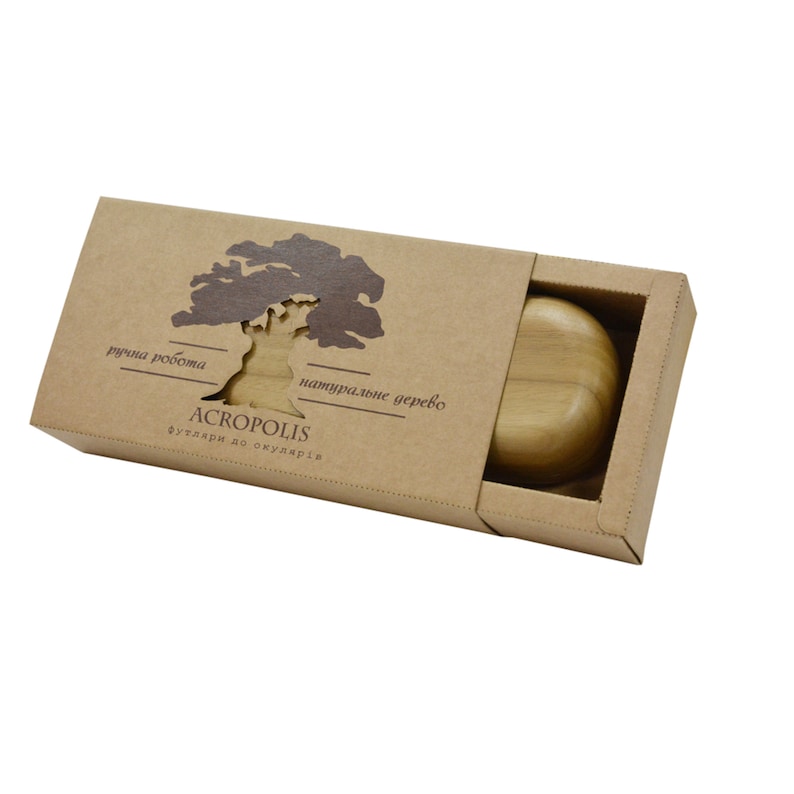 May include: A brown cardboard box with a cutout of a tree and the text "ручна робота" and "натуральне дерево" in brown lettering. The box contains a wooden soap dish.