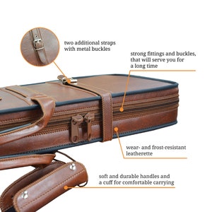 May include: Brown leather guitar case with two adjustable straps, metal buckles, and a zipper closure. The case has a soft handle and a cuff for comfortable carrying.