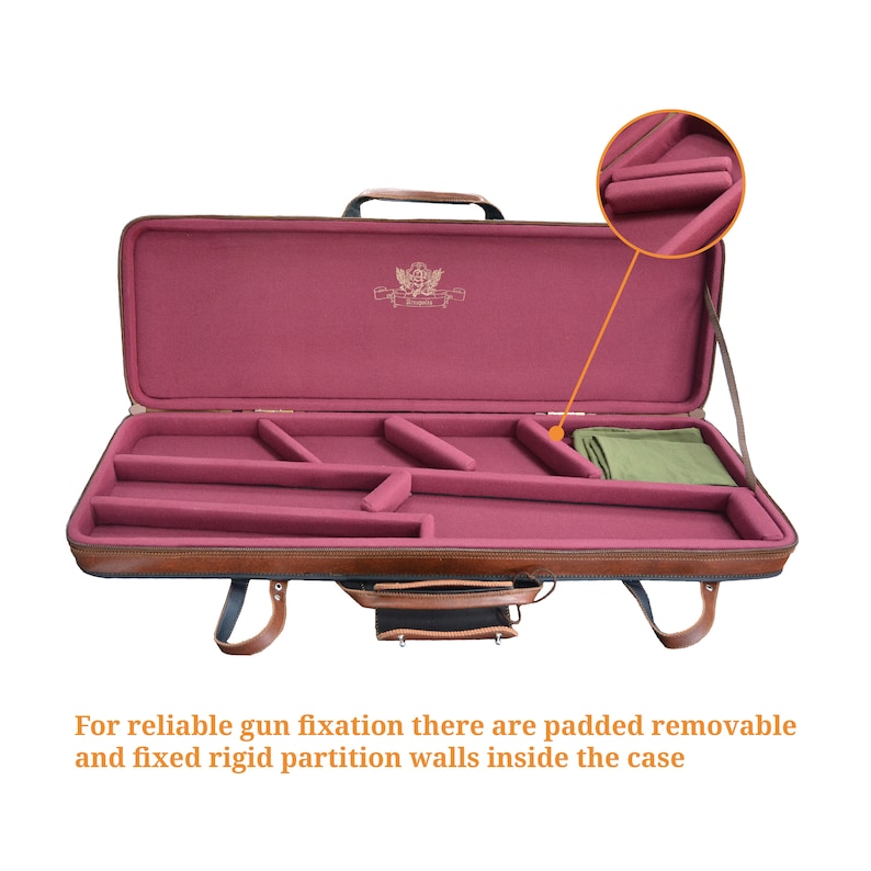 May include: Open brown leather gun case with a burgundy interior. The case has a padded interior with removable and fixed partitions for gun storage.