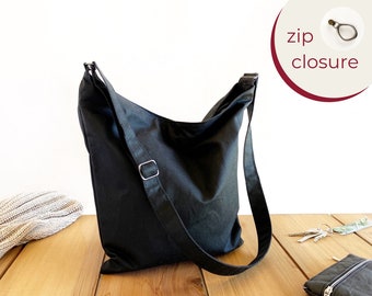 black canvas crossbody bag with zipper for women, made from oilskin
