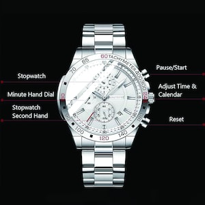 May include: A silver chronograph wristwatch with a white face and black markings. The watch has a tachymeter scale, a date window, and a stopwatch function. The watch is on a silver metal band.