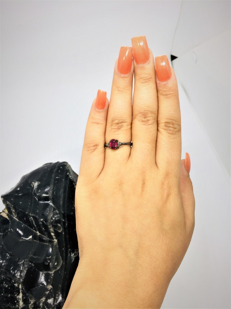 Rhodolite garnet and diamond ring in sterling silver.