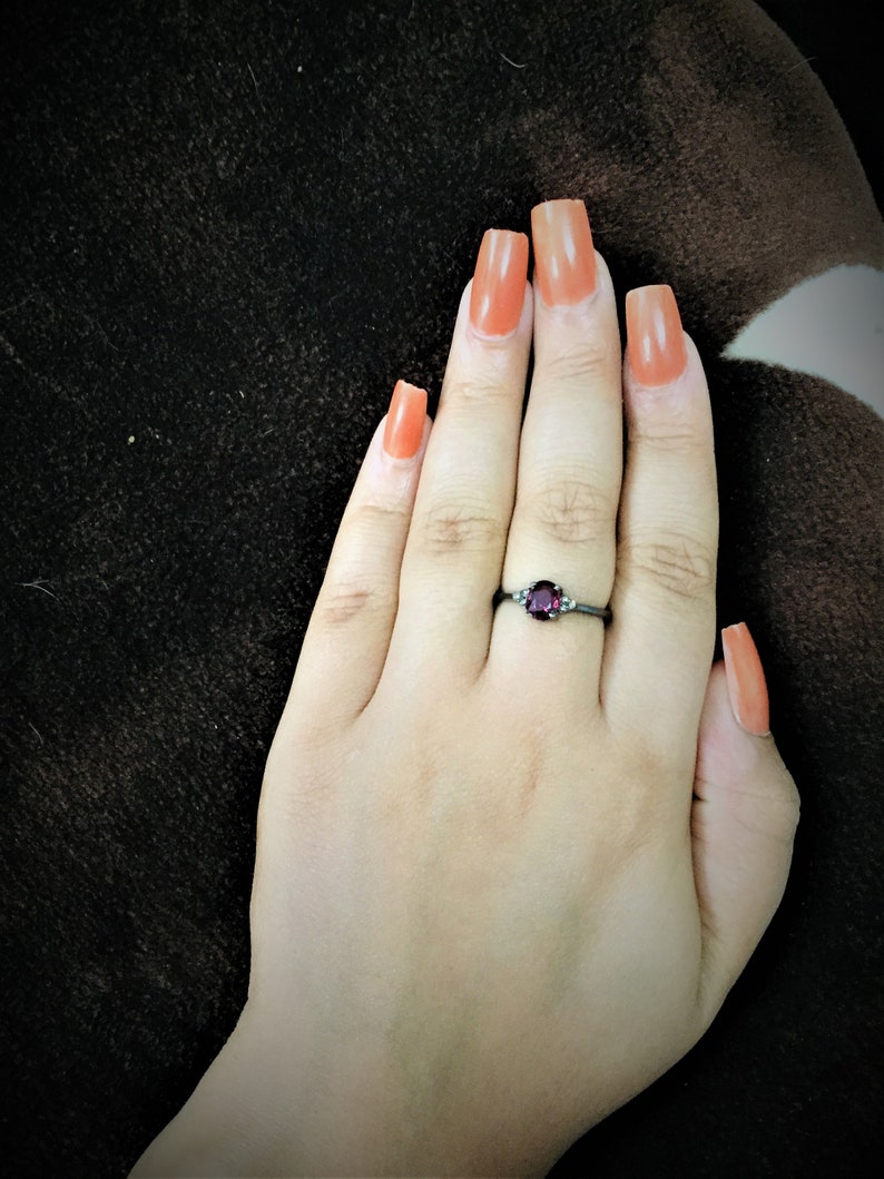Rhodolite garnet and diamond ring in sterling silver.