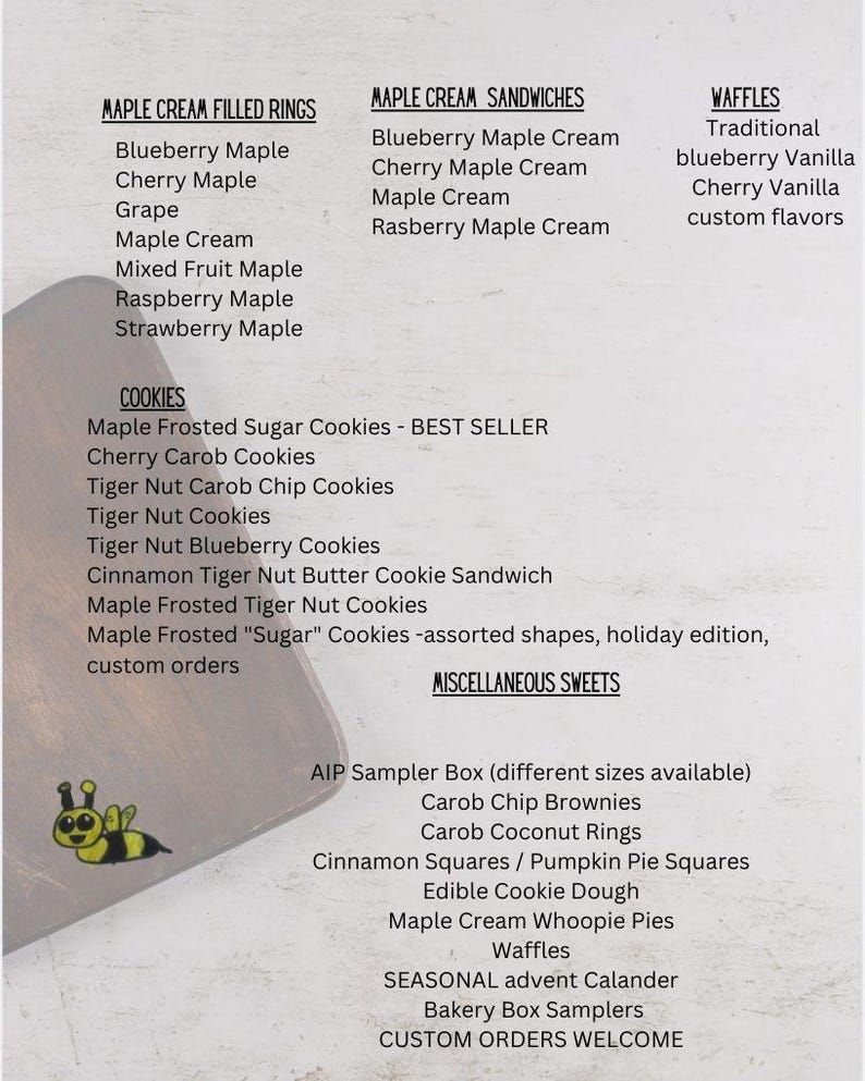 May include: A menu list on a light background featuring categories like Maple Cream Filled Rings, Maple Cream Sandwiches, Waffles, Cookies, and Miscellaneous Sweets, with a small yellow and black bee illustration in the bottom left corner.