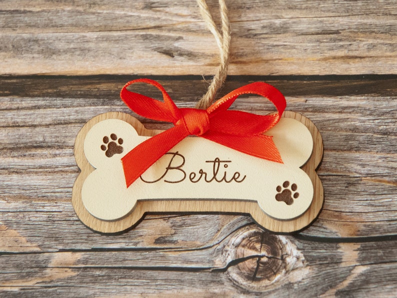 Wooden Dog bone ornament. Paw print ornament. Dog first Christmas. Boxer dog gifts. Personalized dog bone Red Ribbon