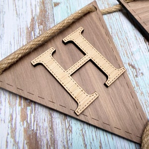 Two tone wood on bunting. Walnut flag and oak letter