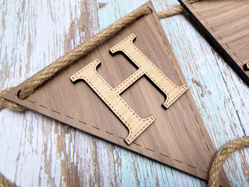 Two tone wood on bunting. Walnut flag and oak letter