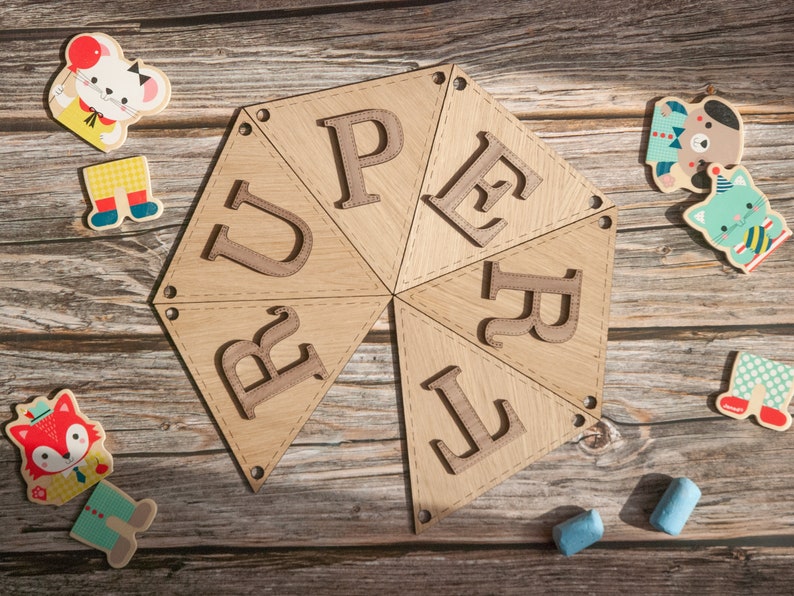 Rupert in bunting letters forming a circle