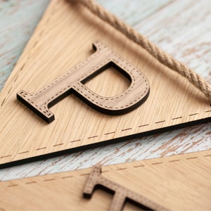 Two tone wood on bunting. Oak flag and walnut letter
