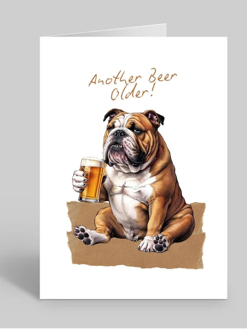 May include: A birthday card featuring a cartoon bulldog holding a glass of beer. The card reads "Another Beer Older!"