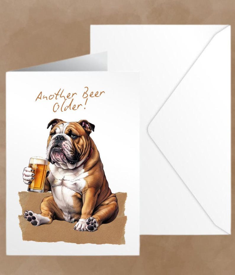 May include: A greeting card featuring a cartoon bulldog holding a glass of beer. The card has the text "Another Beer Older!" in brown lettering.