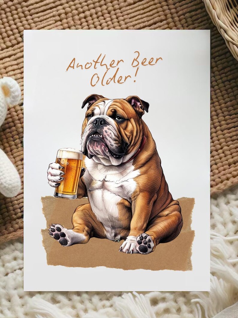 May include: A greeting card with a cartoon illustration of a bulldog holding a glass of beer. The text on the card reads "Another Beer Older!"