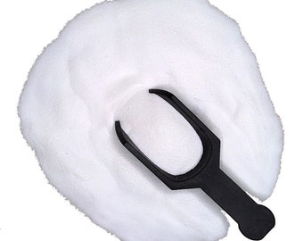 May include: A white powder with a black plastic scoop on top. The scoop is shaped like a small shovel.