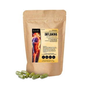 May include: A brown paper bag of Inflamina anti-inflammatory capsules with a label showing a human figure and text. Several green capsules are scattered in front of the bag. The label includes the text "REDUCES INFLAMMATION".