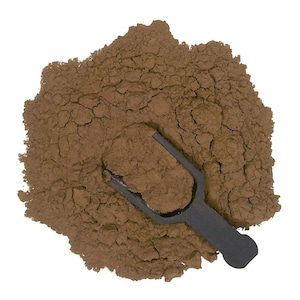 May include: A close-up of a brown powder with a black scoop. The powder is in a pile and the scoop is partially buried in it.
