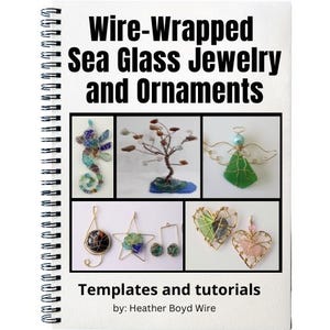 May include: A spiral-bound book titled "Wire-Wrapped Sea Glass Jewelry and Ornaments." The cover features a collage of wire-wrapped sea glass jewelry, including a seahorse, tree, angel, musical note, star, and heart designs. The text "Templates and tutorials" is also visible.