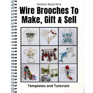 May include: A spiral-bound instructional book titled Wire Brooches To Make, Gift & Sell by Heather Boyd Wire. The cover features a grid of nine photographs displaying various wire-wrapped brooches shaped like faces, hearts, butterflies, angels, animals, and objects.