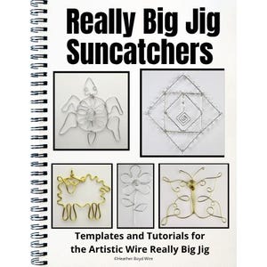 May include: A spiral-bound instructional book titled Really Big Jig Suncatchers, featuring templates and tutorials for wire crafting. The cover displays five wire-formed designs: a turtle, a geometric diamond, a sheep, a flower, and a butterfly.
