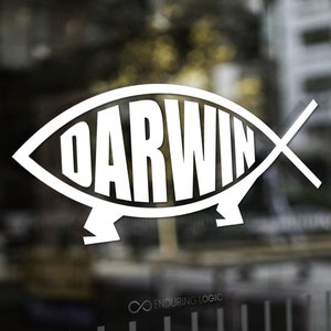 May include: White logo on glass featuring the word "DARWIN" inside a stylized fish shape. The logo is set against a blurred background of a building exterior. The words "Enduring Logic" are at the bottom.