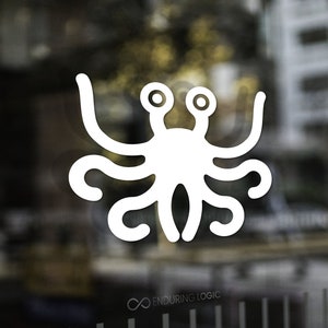 May include: White graphic of the Flying Spaghetti Monster, a parody deity, with two eyes and multiple appendages. The logo is on a glass surface, with the words "Enduring Logic" below.