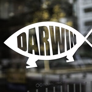May include: White graphic of a fish with the word "DARWIN" in bold, sans-serif font inside. The image is set against a blurred background, with the words "ENDURING LOGIC" at the top left and bottom right.