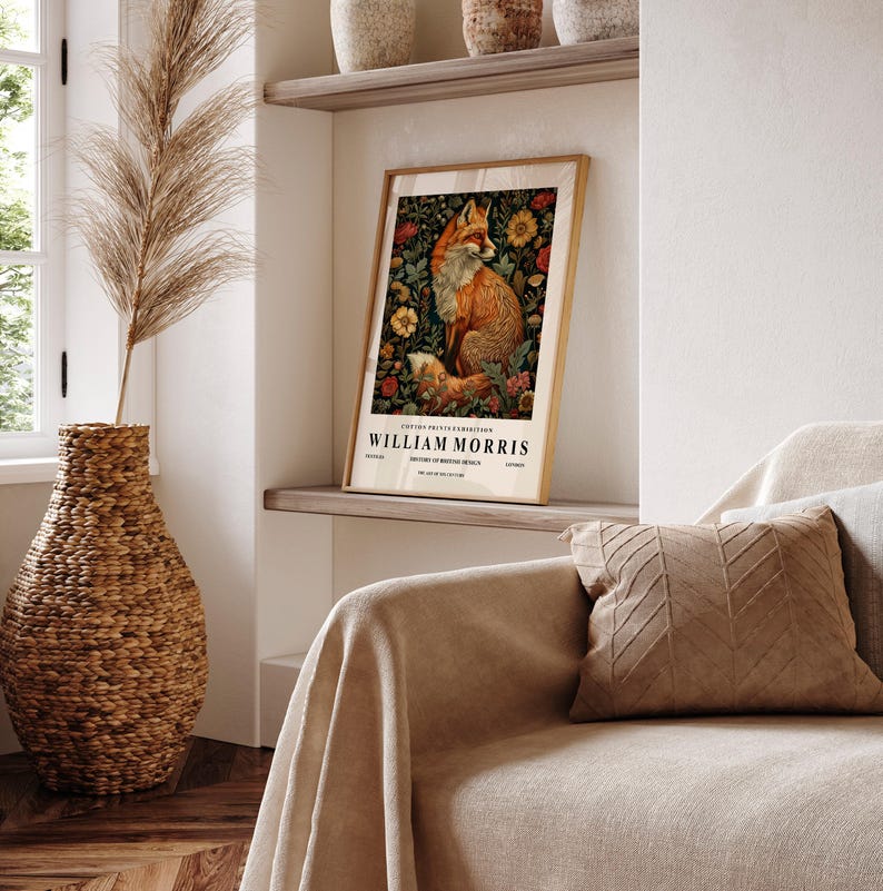 May include: A vintage-style poster featuring a fox surrounded by flowers and foliage. The poster is titled "William Morris" and is printed on a white background with a gold frame.