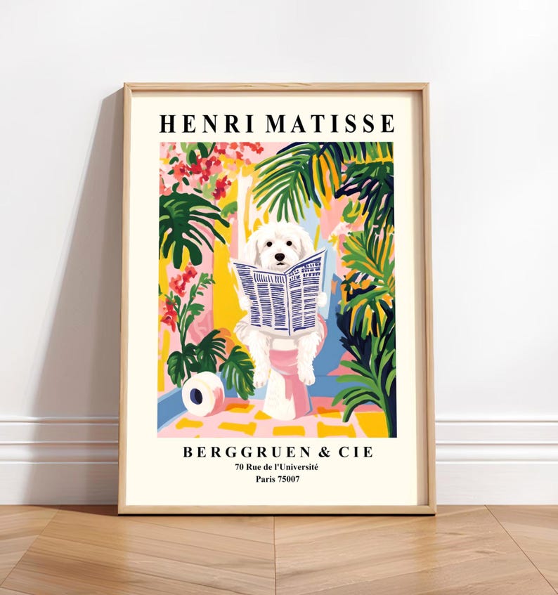 May include: A framed art print depicting a white dog reading a newspaper, set against a vibrant background of flowers and foliage. The print is titled "HENRI MATISSE" and includes the text "BERGGRUEN & CIE".