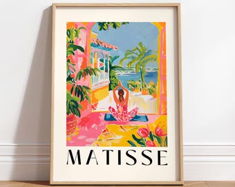 May include: A framed print of a colourful illustration featuring a person sitting in a yoga pose in front of a window with a view of a tropical beach. The text "MATISSE" is printed at the bottom of the print.
