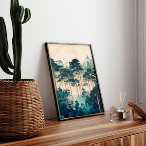 May include: A framed print of a forest scene with tall, dark green trees and a misty background. The print is in a black frame and is hanging on a wall.