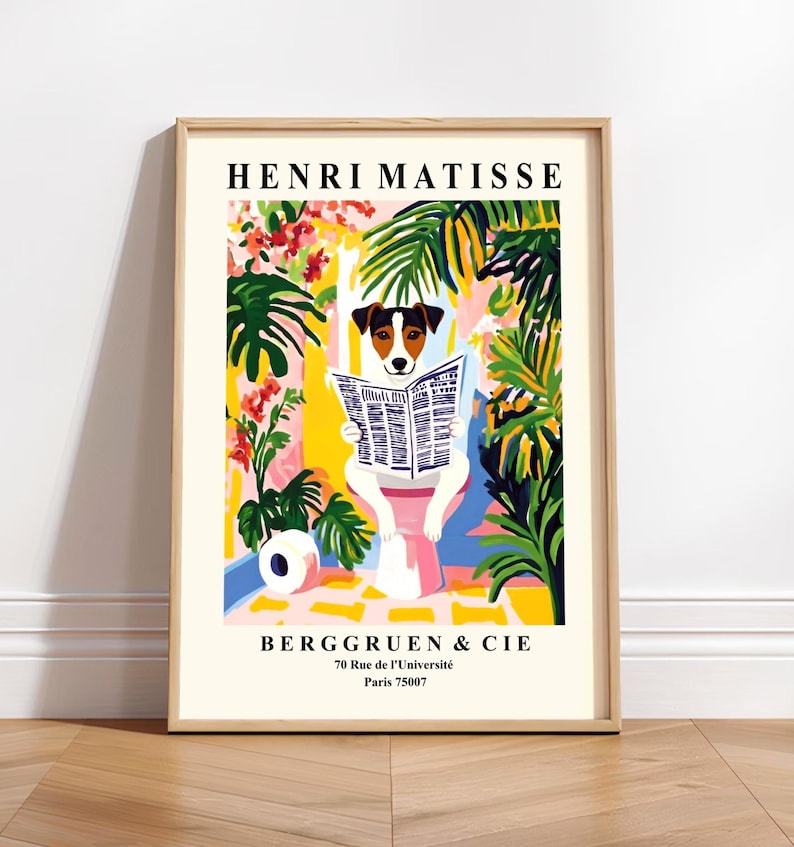 May include: A framed art print featuring a dog reading a newspaper, in a colorful, Matisse-inspired style. The print includes the text "HENRI MATISSE" at the top and "BERGGRUEN & CIE" with an address at the bottom. The dog is white with brown and black markings.