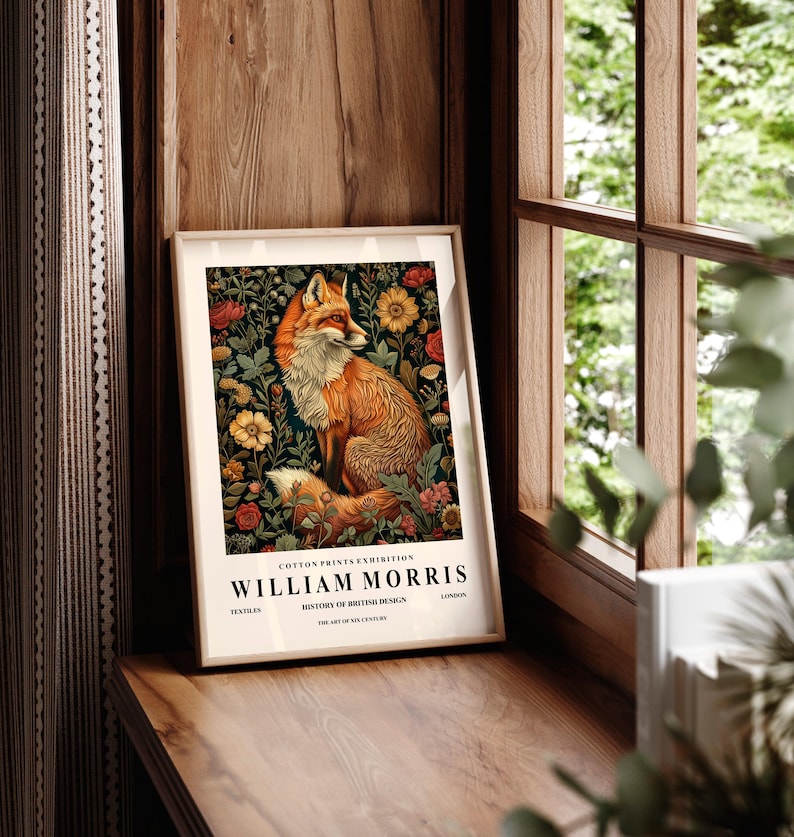 May include: A framed print featuring a fox surrounded by flowers. The print is titled "William Morris" and includes the text "Cotton Prints Exhibition, History of British Design, The Art of the 19th Century".