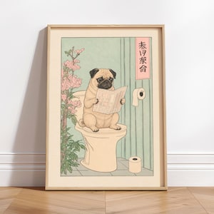 May include: Framed print depicting a pug dog on a toilet, reading a newspaper, in the style of a Japanese woodblock print. The artwork uses soft colours, with floral details and a light green, vertically-lined background.