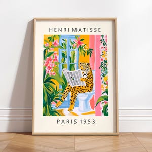 May include: A colorful illustration of a leopard sitting on a toilet and reading a newspaper. The background is a jungle scene with pink and yellow flowers. The text "HENRI MATISSE PARIS 1953" is at the top and bottom of the image.