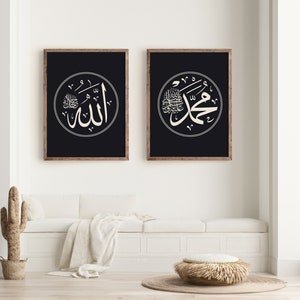 May include: Two framed black and white prints with Arabic calligraphy in white circles on a black background. The text in the left print reads "Allah" and the text in the right print reads "Muhammad".