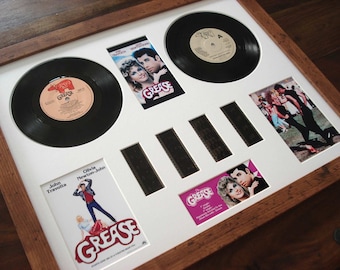 Montaje de película de vinilo Grease de 35 mm con marco de celda