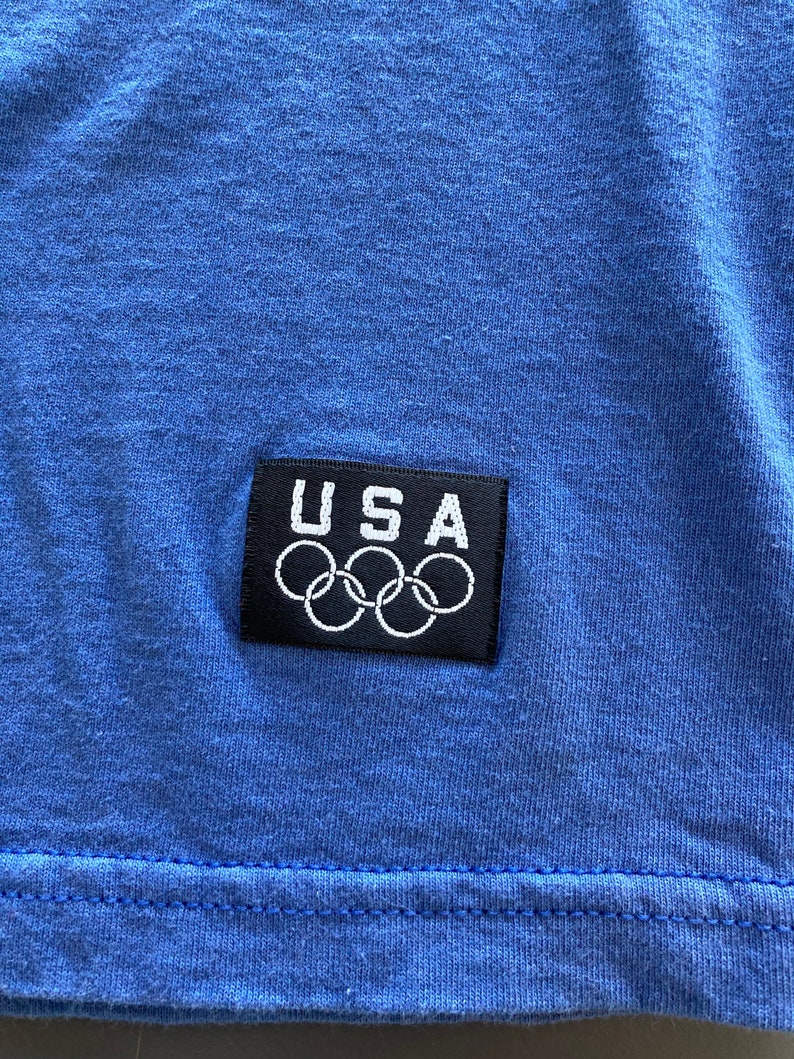 Vintage 90\u2019s JC Penny Blank Blue USA Olympics T Shirt Size Large Athletic Sports Tee
