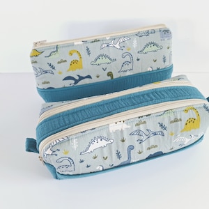 Etui met één of twee vakken, licht kaki en benzineblauw schoolpakket met dinosauruspatroon, etui voor jongens