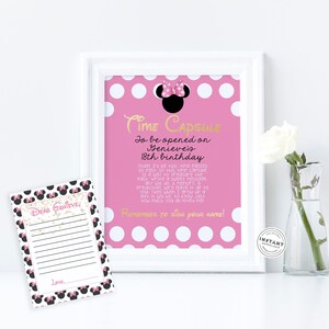 May include: A pink and white polka dot card with a gold inscription that reads "Time Capsule to be opened on Genevieve's 18th birthday". The card features a black and pink Minnie Mouse head with a bow. A separate card with a black and pink polka dot background and a black Minnie Mouse head with a bow reads "Dear Genevieve".