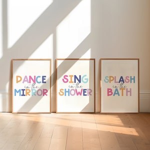 May include: Three framed prints with colorful text. The prints read "Dance in the Mirror", "Sing in the Shower", and "Splash in the Bath".