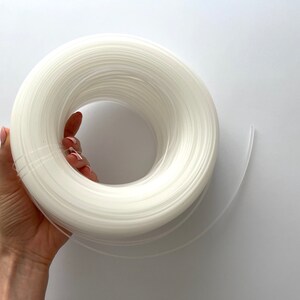 Clear plastic boning set for garment making, suitable for bridal wear, corsets, and structured clothing