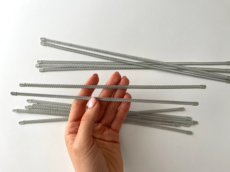 Close-up of flexible spiral steel corset boning, 1/2 inch wide for dressmaking and costume design