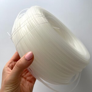 Clear plastic boning flexibility demonstration, ideal for comfortable corsets and costume design