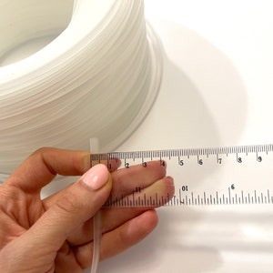 Transparent plastic corset boning for structured garment making, ideal for corsets, bridal wear, and costumes