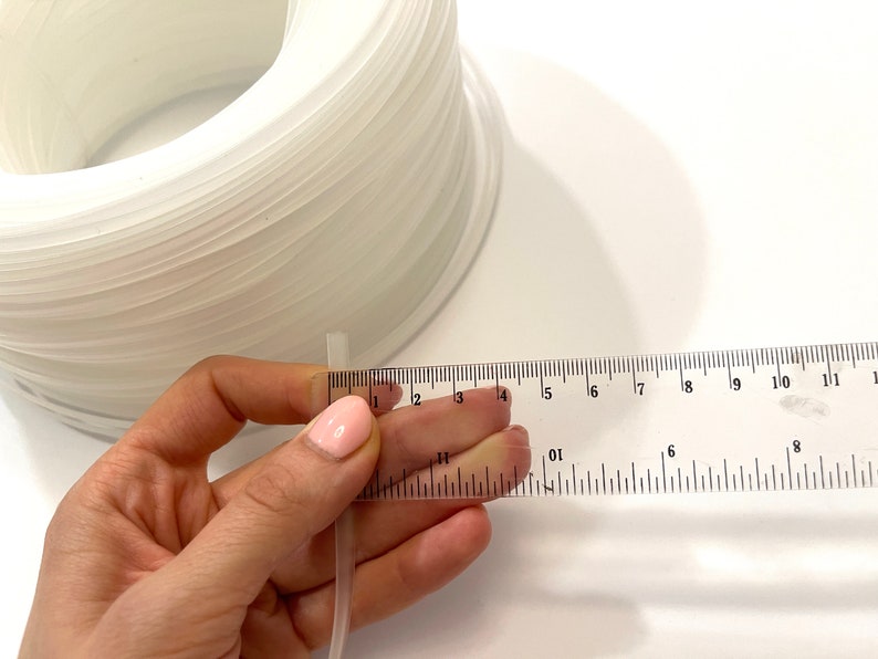 Transparent plastic corset boning for structured garment making, ideal for corsets, bridal wear, and costumes