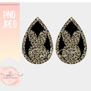 Peut inclure: Une paire de boucles d'oreilles pendantes avec un motif l&eacute;opard noir et or. Les boucles d'oreilles sont en forme de goutte et ont un fond noir avec un motif l&eacute;opard dor&eacute; superpos&eacute;.