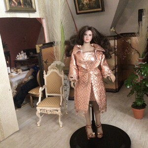 1/12 Tbleague T05 curvyPhicen 2 piece outfit includes rose gold faux leather coat, skirt/dress, jewelry and  sandals.
